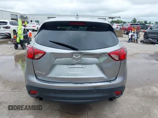 2014 Mazda CX-5 Touring z VIN JM3KE2CY8E0369145, wystawiony jako IAAI lot #42462985 z przebiegiem 155 480 mil mil oraz . Historia ofert i sprzedaży dostępna na DreamBid. Obrazek 16.