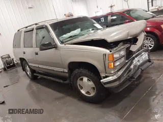 1999 GMC Yukon with VIN 1GKEK13R7XJ723255, listed as a IAAI auction lot 41879617 with 148,324 mi miles. Bid and sale history available at carsss.com. Image 1.
