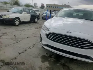 2020 Ford Fusion SE z VIN 3FA6P0T9XLR138977, wystawiony jako Copart lot #55260085 z przebiegiem 92 470 mil mil oraz Szkoda całkowita • Salvage title. Historia ofert i sprzedaży dostępna na DreamBid. Obrazek 14.