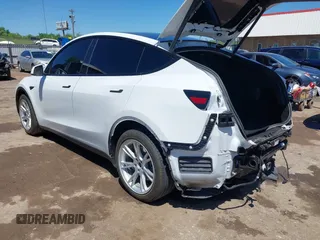 2020 Tesla Model Y Long Range z VIN 5YJYGDEE0LF035248, wystawiony jako IAAI lot #42162191 z przebiegiem 115 533 mil mil oraz . Historia ofert i sprzedaży dostępna na DreamBid. Obrazek 3.