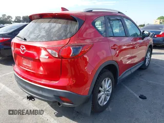 2016 Mazda CX-5 Sport with VIN JM3KE2BY4G0701442, listed as a IAAI auction lot 41682335 with 125,624 mi miles. Bid and sale history available at carsss.com. Image 4.