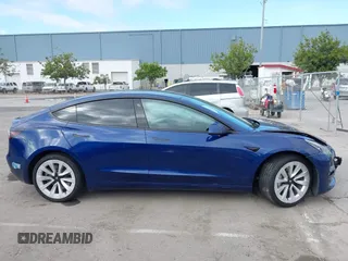 2021 Tesla Model 3 Standard Range Plus z VIN 5YJ3E1EA9MF020860, wystawiony jako IAAI lot #42246074 z przebiegiem 52 674 mil mil oraz . Historia ofert i sprzedaży dostępna na DreamBid. Obrazek 13.