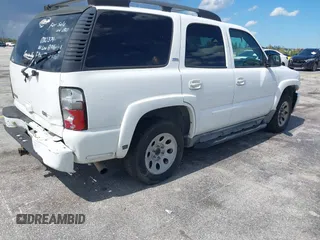 2005 Chevrolet Tahoe Z71 z VIN 1GNEC13T05R219656, wystawiony jako IAAI lot #42802342 z przebiegiem 265 766 mil mil oraz . Historia ofert i sprzedaży dostępna na DreamBid. Obrazek 4.