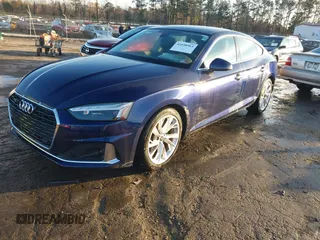 2023 Audi A5 Sportback Premium z VIN WAUABCF58PA032618, wystawiony jako IAAI lot #41048963 z przebiegiem 2 740 mil mil oraz . Historia ofert i sprzedaży dostępna na DreamBid. Obrazek 18.