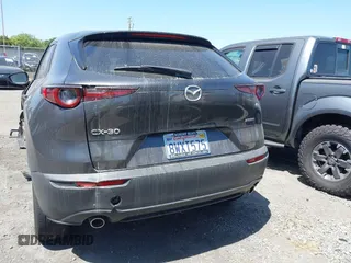 2021 Mazda CX-30 Select z VIN 3MVDMABL3MM233701, wystawiony jako IAAI lot #42086778 z przebiegiem Nie podano mil oraz . Historia ofert i sprzedaży dostępna na DreamBid. Obrazek 17.