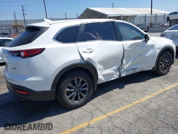 2020 Mazda CX-9 Sport with VIN JM3TCABY1L0406720, listed as a IAAI auction lot 42304144 with 75,887 mi miles and . Bid and sale history available at DreamBid. Image 4.