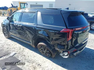2025 Kia Carnival SX with VIN KNDNE5K35S6472142, listed as a IAAI auction lot 41280650 with 4,181 mi miles and . Bid and sale history available at DreamBid. Image 3.