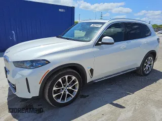 2025 BMW X5 xDrive40i z VIN 5UX23EU02S9W33216, wystawiony jako Copart lot #57442255 z przebiegiem 32 563 mil mil oraz Czysty tytuł • Clean title. Historia ofert i sprzedaży dostępna na DreamBid. Obrazek 1.