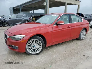 2014 BMW 3 Series 328i xDrive with VIN WBA3B3C59EJ977670, listed as a Copart auction lot 61997165 with 128,937 mi miles and Salvage title. Bid and sale history available at DreamBid. Image 1.