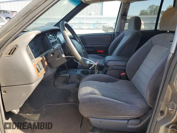 1998 Jeep Grand Cherokee Laredo with VIN 1J4GZ58S5WC165213, listed as a Copart auction lot 77611434 with 168,688 mi miles and Salvage Title. Bid and sale history available at carsss.com. Image 7.