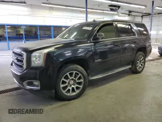 2015 GMC Yukon SLE with VIN 1GKS2AKC6FR229744, listed as a Copart auction lot 88270295 with 215,762 mi miles and Salvage Title. Bid and sale history available at DreamBid. Image 1.