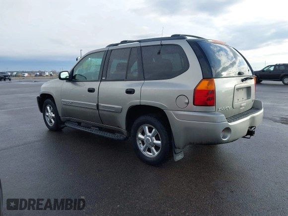 2003 GMC Envoy SLT with VIN 1GKDT13S532308502, listed as a IAAI auction lot 41676188 with 218,626 mi miles. Bid and sale history available at carsss.com. Image 14.