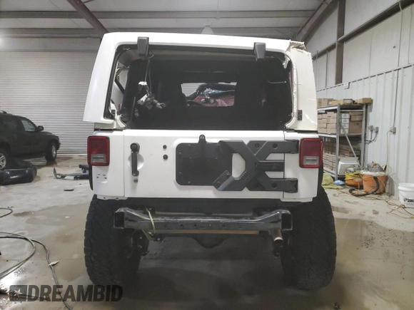 2017 Jeep Wrangler Unlimited Rubicon Recon with VIN 1C4BJWFG3HL577788, listed as a Copart auction lot 82932034 with 142,752 mi miles and Salvage title. Bid and sale history available at DreamBid. Image 6.