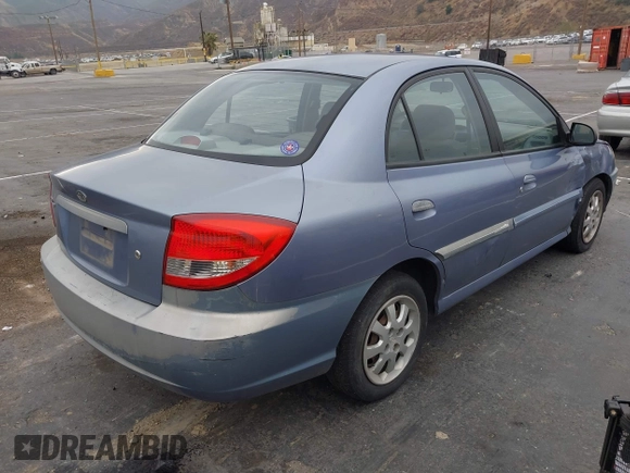2003 Kia Rio with VIN KNADC125736236506, listed as a IAAI auction lot 41467649 with 109,975 mi miles. Bid and sale history available at carsss.com. Image 4.