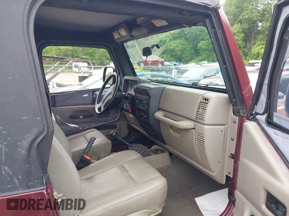 2004 Jeep Wrangler SE with VIN 1J4FA291X4P720783, listed as a IAAI auction lot 42446334 with 69,672 mi miles and . Bid and sale history available at DreamBid. Image 5.