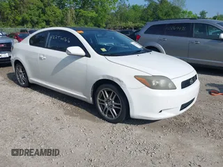 2009 Scion tC z VIN JTKDE167890297232, wystawiony jako IAAI lot #42256166 z przebiegiem 156 595 mil mil oraz . Historia ofert i sprzedaży dostępna na DreamBid. Obrazek 1.