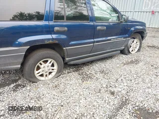 2003 Jeep Grand Cherokee Laredo z VIN 1J4GW48S73C553686, wystawiony jako IAAI lot #42278695 z przebiegiem 154 374 mil mil oraz . Historia ofert i sprzedaży dostępna na DreamBid. Obrazek 6.
