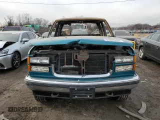 1995 GMC Sierra 1500 z VIN 2GTEK19K0S1570324, wystawiony jako Copart lot #43065205 z przebiegiem Nie podano mil oraz Szkody całkowita. Historia ofert i sprzedaży dostępna na DreamBid. Obrazek 5.
