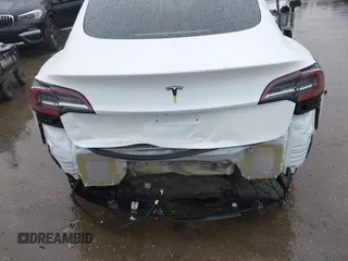 2023 Tesla Model 3 with VIN 5YJ3E1EA8PF578199, listed as a IAAI auction lot 41735465 with 50,823 mi miles and . Bid and sale history available at DreamBid. Image 6.