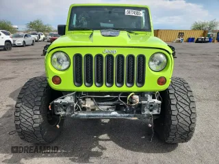 2012 Jeep Wrangler Unlimited Call of Duty MW3 z VIN 1C4BJWFG4CL242211, wystawiony jako Copart lot #59774555 z przebiegiem 117 463 mil mil oraz Szkoda całkowita • Salvage title. Historia ofert i sprzedaży dostępna na DreamBid. Obrazek 5.
