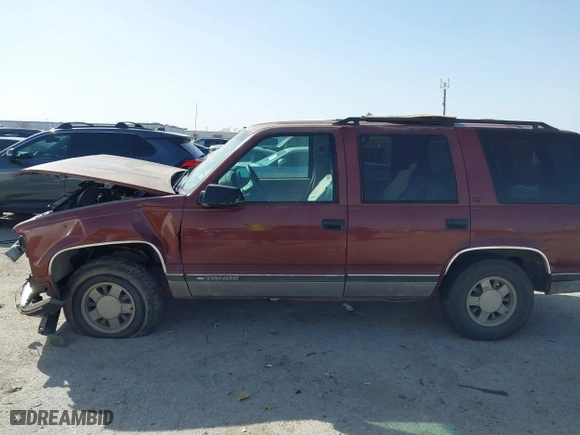 1999 Chevrolet Tahoe with VIN 1GNEC13R9XJ341261, listed as a IAAI auction lot 41741710 with 234,676 mi miles. Bid and sale history available at carsss.com. Image 13.