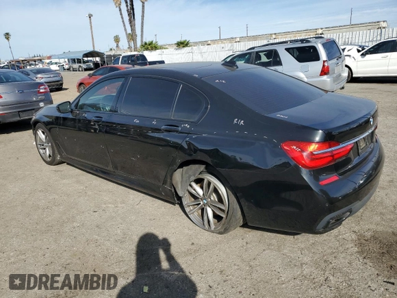 2018 BMW 7 Series 750i with VIN WBA7F0C54JGM23724, listed as a Copart auction lot 89399285 with 141,167 mi miles and Salvage Title. Bid and sale history available at carsss.com. Image 2.