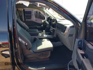 2023 Ford F-150 Lightning Pro with VIN 1FTVW1EV0PWG52297, listed as a IAAI auction lot 41730201 with 11,303 mi miles and . Bid and sale history available at DreamBid. Image 5.