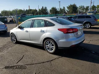 2018 Ford Focus SE z VIN 1FADP3F26JL278091, wystawiony jako Copart lot #63879875 z przebiegiem 81 984 mil mil oraz Czysty tytuł • Clean title. Historia ofert i sprzedaży dostępna na DreamBid. Obrazek 2.