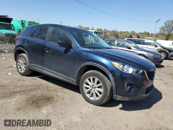 2014 Mazda CX-5 Touring with VIN JM3KE4CY4E0407868, listed as a Copart auction lot 52564315 with 137,989 mi miles and Salvage Title. Bid and sale history available at carsss.com. Image 4.