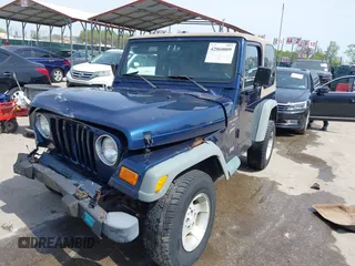 2000 Jeep Wrangler Sport with VIN 1J4FA49S5YP750123, listed as a IAAI auction lot 42060009 with Not Provided miles. Bid and sale history available at carsss.com. Image 2.