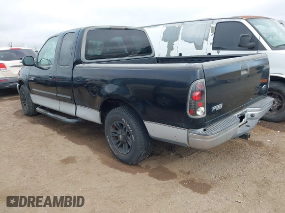 2002 Ford F-150 XL with VIN 1FTRX17W92NC06992, listed as a IAAI auction lot 41194470 with 253,923 mi miles. Bid and sale history available at carsss.com. Image 3.
