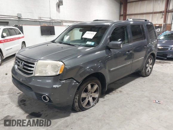 2012 Honda Pilot Touring with VIN 5FNYF4H99CB052034, listed as a IAAI auction lot 42023430 with 137,428 mi miles. Bid and sale history available at carsss.com. Image 2.