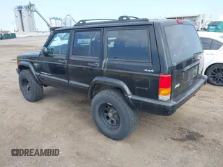 2000 Jeep Cherokee z VIN 1J4FF48S2YL190863, wystawiony jako IAAI lot #42820115 z przebiegiem 133 296 mil mil oraz . Historia ofert i sprzedaży dostępna na DreamBid. Obrazek 3.