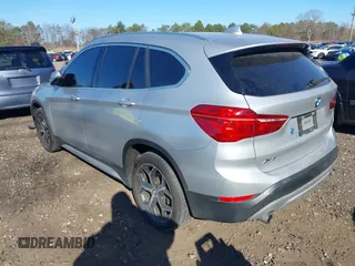 2018 BMW X1 xDrive28i with VIN WBXHT3C30J5L29757, listed as a IAAI auction lot 41879504 with 60,490 mi miles. Bid and sale history available at carsss.com. Image 3.