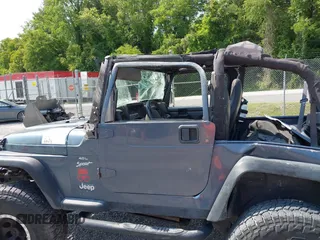 2001 Jeep Wrangler Sport z VIN 1J4FA49S11P322636, wystawiony jako IAAI lot #42409917 z przebiegiem 88 675 mil mil oraz . Historia ofert i sprzedaży dostępna na DreamBid. Obrazek 16.