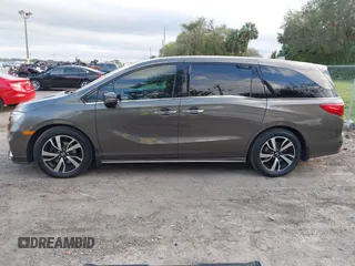 2020 Honda Odyssey Elite with VIN 5FNRL6H91LB030294, listed as a IAAI auction lot 41608291 with 74,477 mi miles and . Bid and sale history available at DreamBid. Image 14.