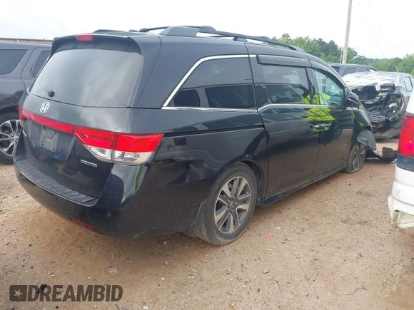 2015 Honda Odyssey Touring Elite with VIN 5FNRL5H90FB065004, listed as a IAAI auction lot 42461597 with 317,523 mi miles and . Bid and sale history available at DreamBid. Image 4.