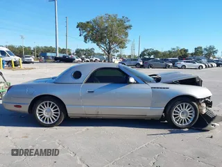 2004 Ford Thunderbird Deluxe with VIN 1FAHP60A84Y100984, listed as a IAAI auction lot 40978553 with 113,051 mi miles. Bid and sale history available at carsss.com. Image 13.