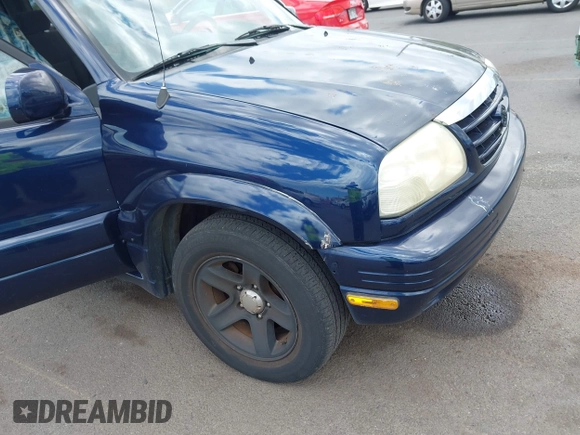 2003 Suzuki Grand Vitara z VIN JS3TE62VX34101877, wystawiony jako IAAI lot #42360315 z przebiegiem 171 207 mil mil oraz . Historia ofert i sprzedaży dostępna na DreamBid. Obrazek 6.
