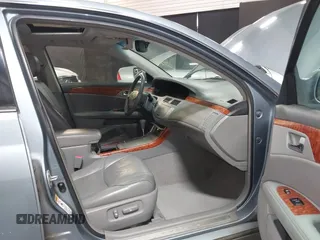 2007 Toyota Avalon XL z VIN 4T1BK36B17U189303, wystawiony jako IAAI lot #41614917 z przebiegiem 238 114 mil mil oraz . Historia ofert i sprzedaży dostępna na DreamBid. Obrazek 5.
