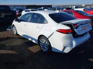 2023 Toyota Corolla Hybrid LE with VIN JTDBCMFE1PJ011085, listed as a IAAI auction lot 41340297 with 34,437 mi miles. Bid and sale history available at carsss.com. Image 3.