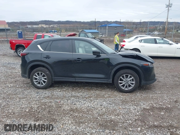 2023 Mazda CX-5 S Carbon Edition z VIN JM3KFBCM9P0130796, wystawiony jako IAAI lot #41956104 z przebiegiem 21 796 mil mil oraz . Historia ofert i sprzedaży dostępna na DreamBid. Obrazek 13.
