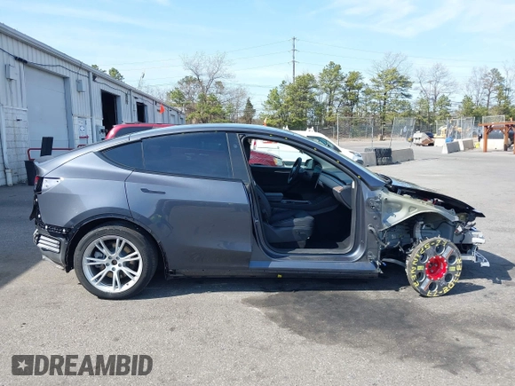 2023 Tesla Model Y Long Range with VIN 7SAYGDEE7PF856985, listed as a IAAI auction lot 42097675 with 13,112 mi miles and . Bid and sale history available at DreamBid. Image 14.
