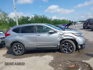 2018 Honda CR-V Touring with VIN 7FARW1H90JE012526, listed as a IAAI auction lot 42055078 with 96,098 mi miles and . Bid and sale history available at DreamBid. Image 13.