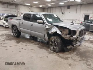 2018 Toyota Tacoma SR with VIN 3TMCZ5AN1JM149820, listed as a IAAI auction lot 41706358 with 76,911 mi miles. Bid and sale history available at carsss.com. Image 1.