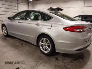 2018 Ford Fusion SE with VIN 3FA6P0HD1JR243112, listed as a IAAI auction lot 42256676 with 112,003 mi miles and . Bid and sale history available at DreamBid. Image 3.