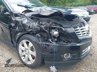 2015 Cadillac SRX Premium Collection z VIN 3GYFNGE36FS626641, wystawiony jako IAAI lot #42532380 z przebiegiem 178 799 mil mil oraz . Historia ofert i sprzedaży dostępna na DreamBid. Obrazek 6.