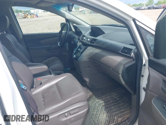 2012 Honda Odyssey EX-L with VIN 5FNRL5H63CB117341, listed as a IAAI auction lot 42197815 with 256,544 mi miles and . Bid and sale history available at DreamBid. Image 5.