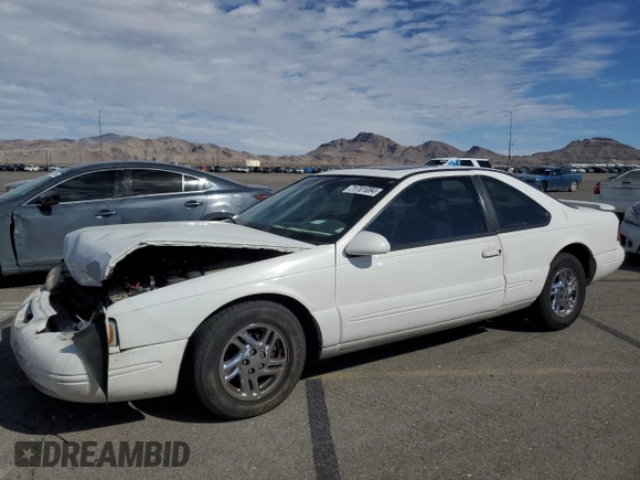 1996 Ford Thunderbird LX z VIN 1FALP62W7TH119284, wystawiony jako Copart lot #71701084 z przebiegiem 239 462 mil mil oraz Szkoda całkowita • Salvage title. Historia ofert i sprzedaży dostępna na DreamBid. Obrazek 1.