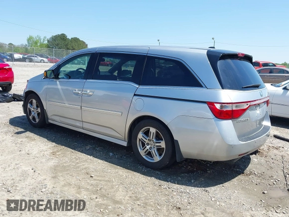 2012 Honda Odyssey Touring with VIN 5FNRL5H96CB043939, listed as a IAAI auction lot 41983643 with 202,535 mi miles. Bid and sale history available at carsss.com. Image 3.